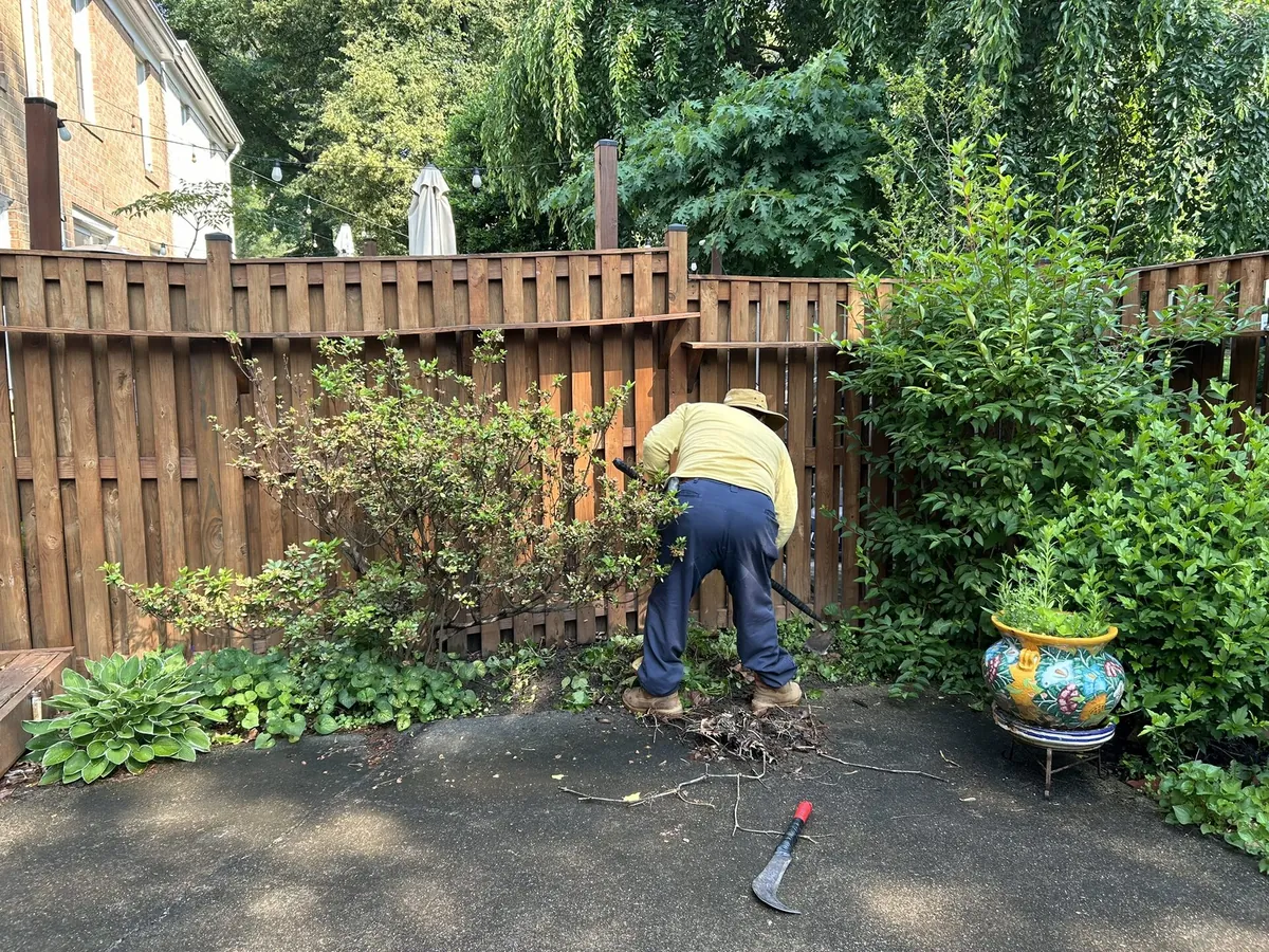 Crew member working on fence