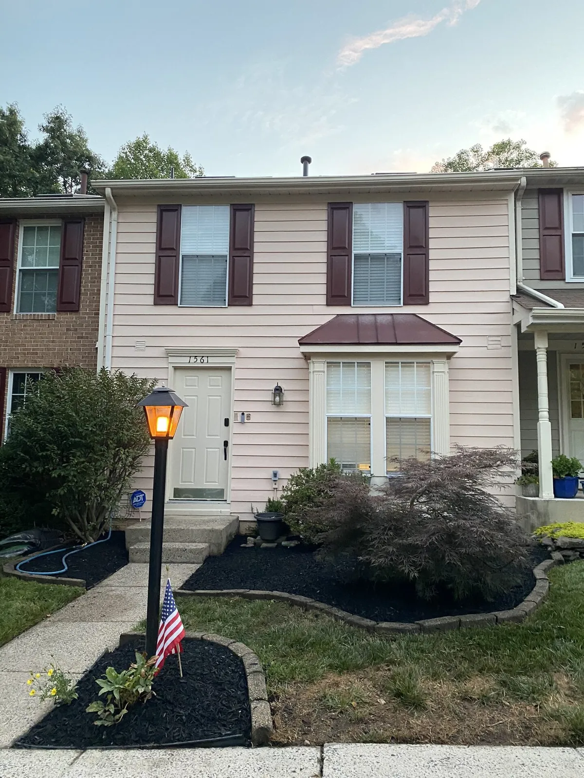 Townhouse with fresh black mulch and Japanese maple landscaping